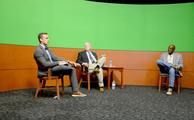 Noah Walker, left, and Jake Hill, candidates for the Lake City Council District 12 seat, discussed expanding the city’s utilities during the candidate forum Thursday night. (CARL MCKINNEY/Lake City Reporter)