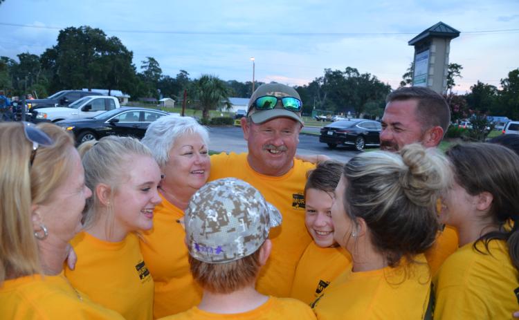 Tim Murphy, center, is congratulated by family members and supporters Tuesday night after winning his re-election bid to the County Commission. (CARL MCKINNEY/Lake City Reporter)