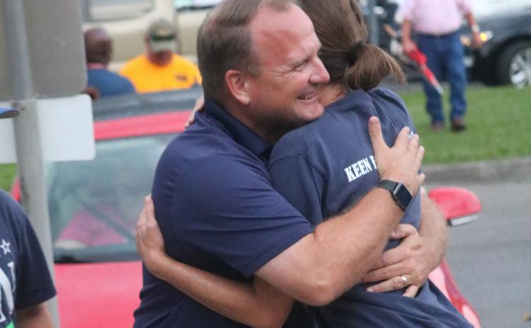 Kyle Keen hugs his wife, Brandi, Tuesday night outside the Supervisor of Elections office after winning the Tax Collector’s primary race. With the win, Keen advances to November’s general election. (JAMIE WACHTER/Lake City Reporter)