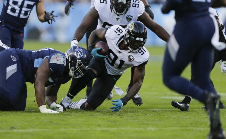 Jacksonville Jaguars defensive end Yannick Ngakoue (91) gets control of a fumble by the Tennessee Titans on Nov. 24, 2019 at Nissan Stadium in Nashville, Tennessee. The Minnesota Vikings sent a 2021 second-round pick and a conditional 2022 fifth-rounder to Jacksonville in a trade for Ngakoue. (SILA WALKER/Getty Images/TNS)