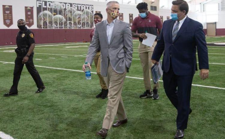 Gov. Ron DeSantis and FSU Head Football Coach Mike Norvell both advocate playing college football this fall. (TORI LYNN SCHNEIDER/Tallahassee Democrat/TNS)
