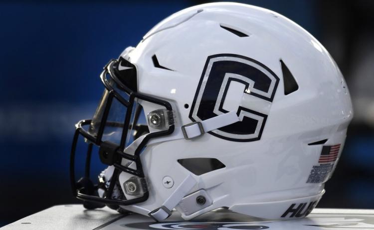 A Connecticut football helmet rests on the sideline during an NCAA college football game on Sept. 7, 2019, in East Hartford, Conn. UConn has canceled its 2020-2021 football season, becoming the first FBS program to suspend football because of the coronavirus pandemic. (AP FILE PHOTO)