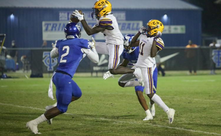 Columbia wide receiver Jaden Williams hauls in a pass in front of Trinity Christian defensive back Christian Ellis on Friday night. (BRENT KUYKENDALL/Lake City Reporter)