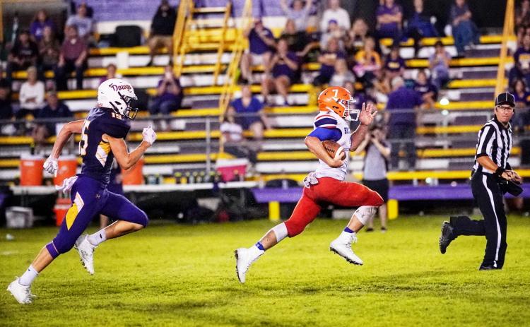 Branford running back Bodhi White breaks away to score one of his three touchdowns against Bell on Friday. (BRIAN LEWIS/Special to the Reporter)