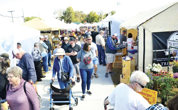 A large crowd of festival-goers milled around Wilson Park at this past year’s Olustee Battle Festival. Lake City’s largest and oldest festival, though, was canceled for February due to health concerns from covid-19. (FILE)