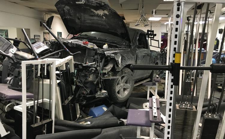 A truck sits in the middle of Branford Fitness and Tanning after ramming into the gym late Monday night. Nobody was injured in the crash. (COURTESY BILL PROCKO)