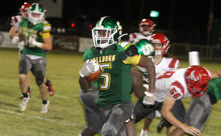 Suwannee defensive back Terrell Atkinson races down the sideline on an interception return for a touchdown on the final play of the first half Friday night against Bradford at Langford Stadium. (PAUL BUCHANAN/Special to the Reporter)