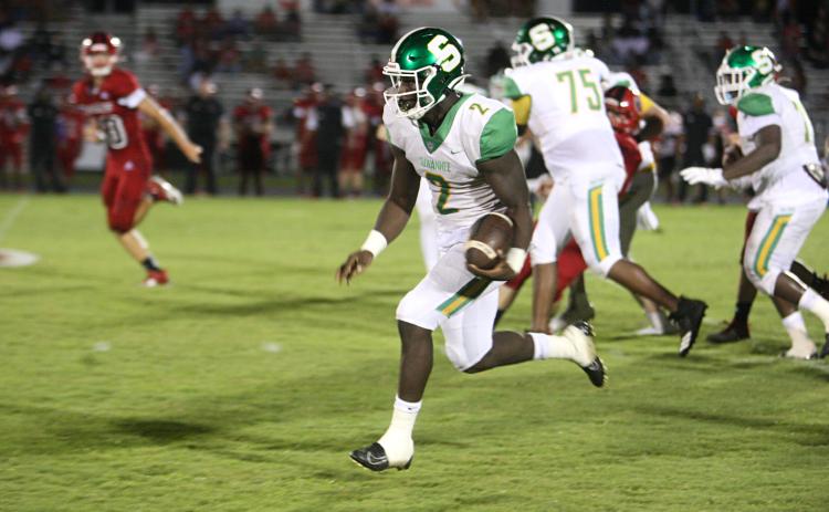 Suwannee quarterback Jaquez Moore scrambles up the field against Hamilton County last Friday. (PAUL BUCHANAN/Special to the Reporter)
