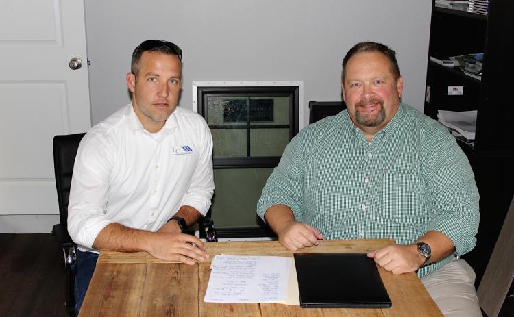 Columbia Builder’s Association President Isaiah Cully (left) and Lake City Reporter Publisher Todd Wilson discuss this year’s Parade of Homes, which is scheduled for the weekend of October 24-25. (BRYAN ZECHER/Special to the Reporter)