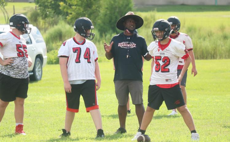 Fort White coach Demetric Jackson talks with his offensive line during Tuesday’s practice. (JORDAN KROEGER/Lake City Reporter)