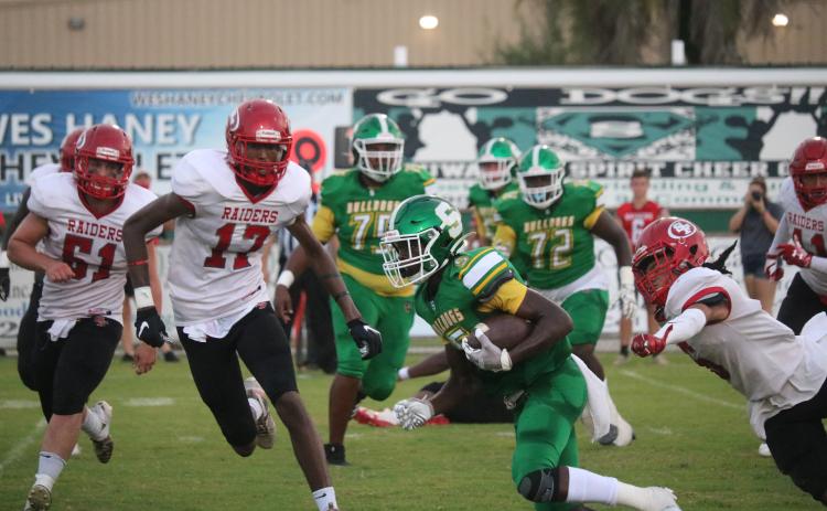 Suwannee receiver Terrell Atkinson speeds up the field with the ball against Santa Fe last Friday. (TONY BRITT/Lake City Reporter)