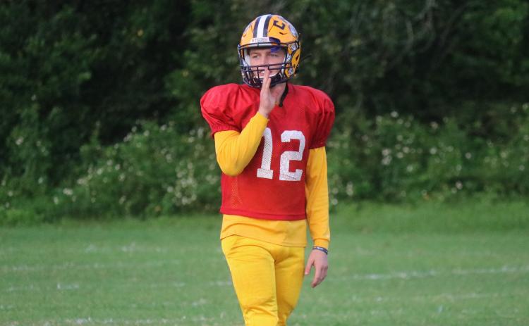 Columbia quarterback Ty Wehinger calls out to a receiver during Tuesday’s practice. (JORDAN KROEGER/Lake City Reporter)
