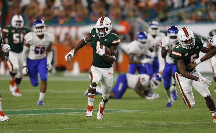 Former Miami running back Lorenzo Lingard runs in for a touchdown against Savannah State on Sept. 8, 2018, in Miami Gardens. No. 5 Florida will rely on a number of newcomers, including Lingard, as it tries to dethrone rival Georgia in the Southeastern Conference’s East Division. Some of them are freshmen, others are transfers. (AP FILE PHOTO)