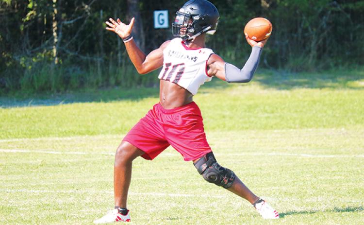 Fort White quarterback Tyler Jefferson throws during practice last season. The Indians will hold their first fall practice on Tuesday. (FILE)