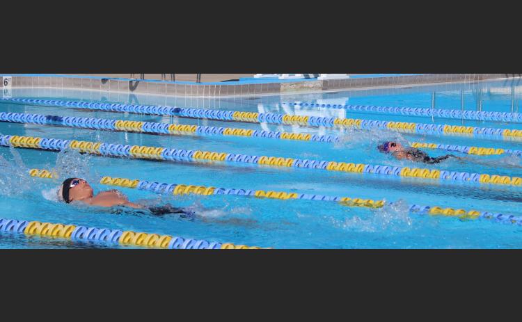 Columbia swimmers compete in the 200 medley relay during Thursday’s Purple & Gold meet.