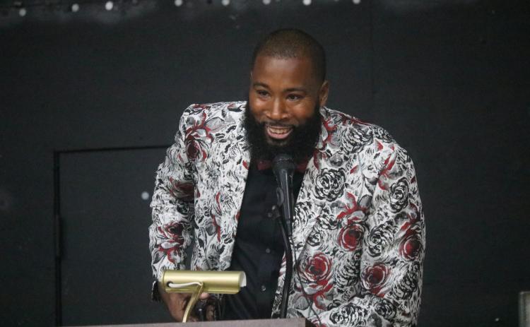 Former Suwannee basketball player Antwan Jones speaks during the school’s Hall of Fame induction ceremony last Thursday. Jones was one of five inducted. (JAMIE WACHTER/Lake City Reporter)