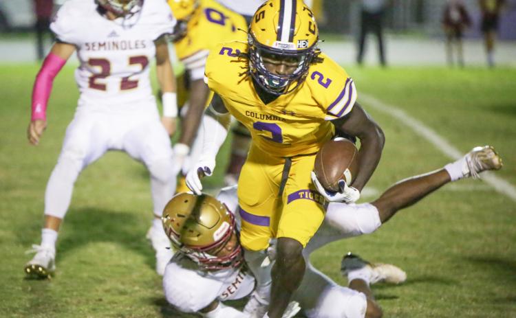 Columbia receiver Jaden Williams escapes a tackle from a Florida High defender last Friday. (BRENT KUYKENDALL/Lake City Reporter)