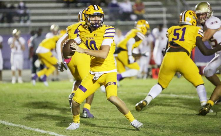 Columbia quarterback Kade Jackson drops back to pass against Florida High on Friday night. (BRENT KUYKENDALL/Lake City Reporter)