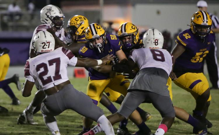 Columbia offensive lineman Joshua Simpson blocks during a play against Madison County on Oct. 9. (BRENT KUYKENDALL/Lake City Reporter)