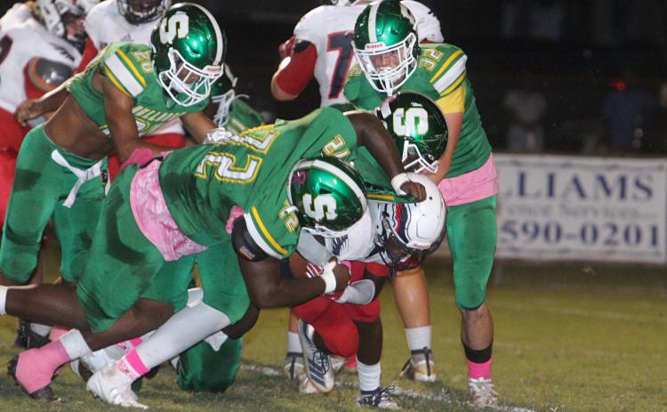 Suwannee’s defense converges for a tackle against Wakulla on Friday night. (PAUL BUCHANAN/Special to the Reporter)