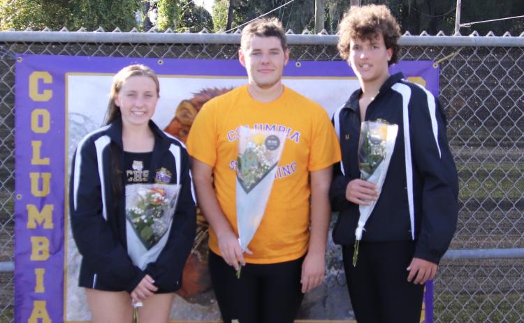 Columbia swimmers Mackenzie Conklin, Alex Jewett and R.J. Dutch were honored on Senior Night during Tuesday’s meet against Suwannee. (SHELBY CONKLIN/Special to the Reporter)