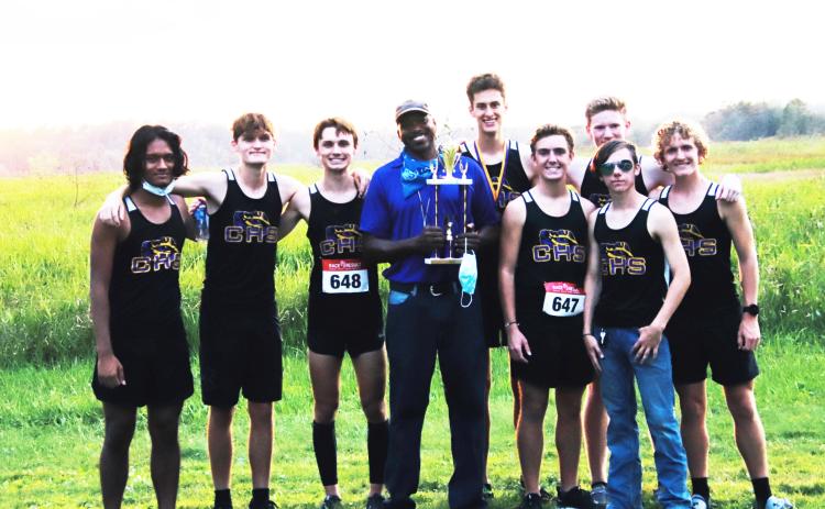 Columbia’s cross country team is pictured with coach Lawrence Davis after winning the Tiger Run at Alligator Lake on Thursday. (SHELBY CONKLIN/Special to the Reporter)