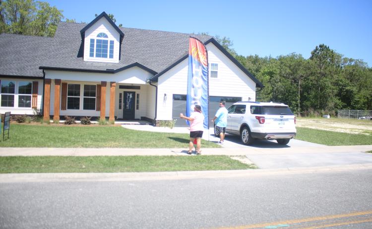 People arrive to look at a house on last year’s Parade of Homes. (FILE)