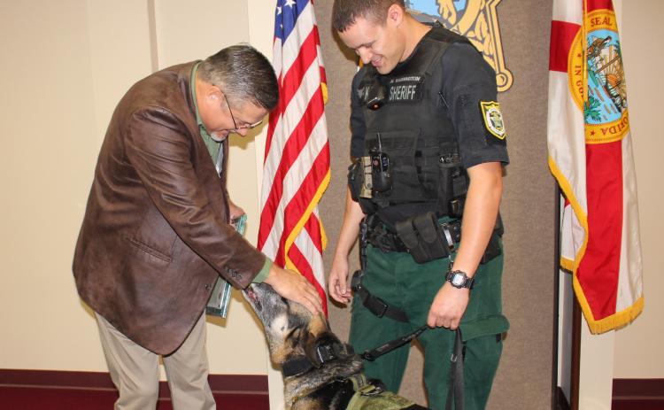 Columbia County Sheriff Mark Hunter thanks K9 officer Rek for his six years of service with the sheriff’s office. Rek was retired Monday and adopted by his handler/partner, Deputy Matthew Waddington. (COURTESY Columbia County Sheriff's Office)