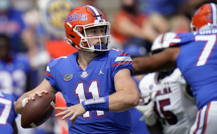 Florida quarterback Kyle Trask (11) throws a pass against South Carolina on Saturday in Gainesville. (JOHN RAOUX/Associated Press)