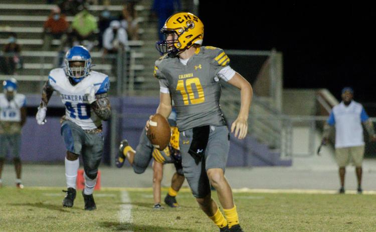 Columbia quarterback Kade Jackson looks to pass against Lee on Friday night. (RAY CARPENTER PHOTOGRAPHY)