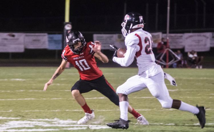 Fort White defensive back Sydney Parrish moves on for a tackle against Baldwin on Friday night. (CHRISTINA FEAGIN/Special to the Reporter)