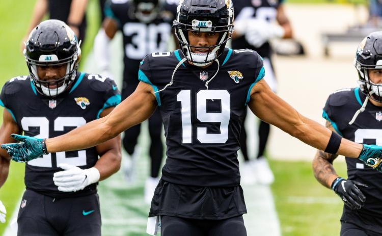 Jacksonville Jaguars wide receiver Collin Johnson (19) walks with running back Devine Ozigbo (22) before the Jaguars game against the Cleveland Browns at TIAA Bank Field on Sunday in Jacksonville. (MATT PENDLETON/TNS)