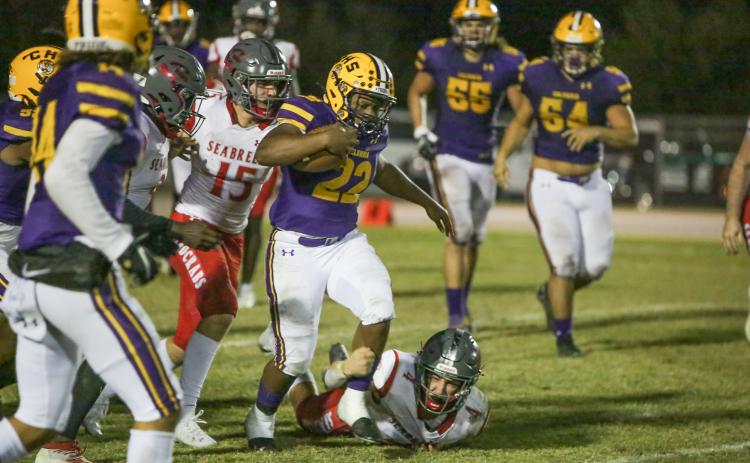 Columbia running back Tony Fulton escapes a tackle against Seabreeze during Friday’s Region 1-6A quarterfinal. (BRENT KUYKENDALL/Lake City Reporter)