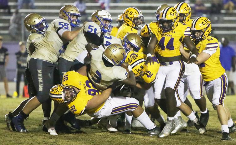 Columbia defensive lineman Nate Walmsley tackles Daytona Beach Mainland quarterback Theodore Lockley during Friday’s Region 1-6A semifinal. (BRENT KUYKENDALL/Lake City Reporter)
