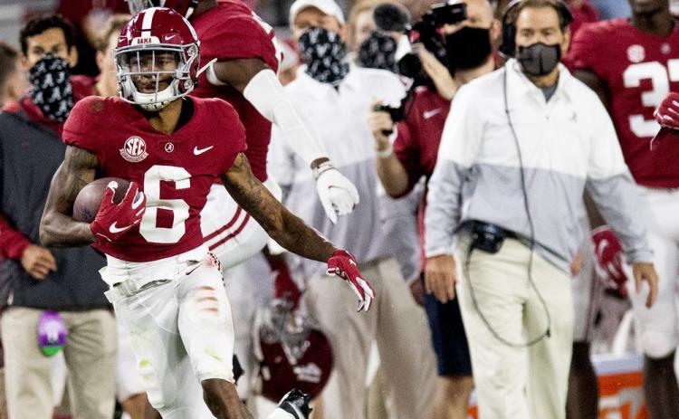 Alabama wide receiver DeVonta Smith (6) heads for a long gain as coach Nick Saban watches during a game against Kentucky on Nov. 21 in Tuscaloosa, Ala. (MICKEY WELSH/The Montgomery Advertiser via AP)