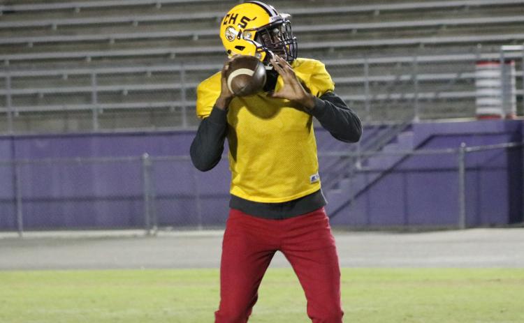 Columbia quarterback Marcus Peterson drops back to pass during Tuesday’s practice. (JORDAN KROEGER/Lake City Reporter)