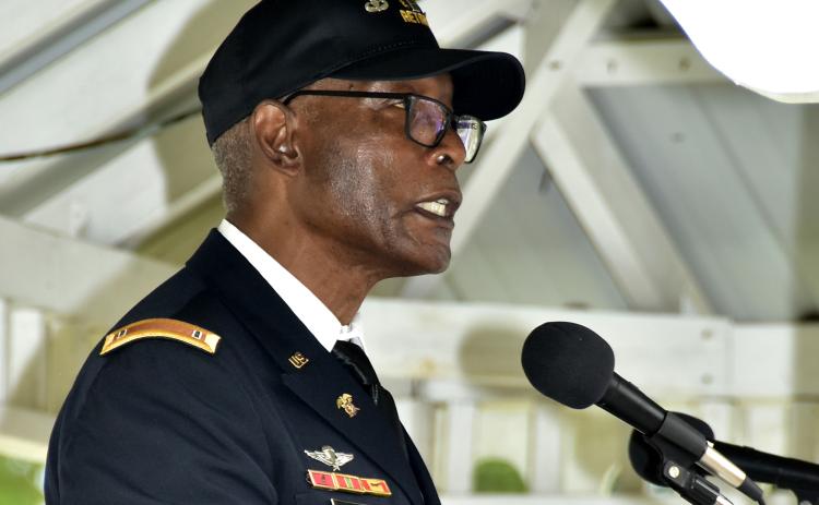 Robert Ford, who spent 26 years in the U.S. Army, said the ending of the pledge of allegiance is a promise that will guide the nation to ‘real liberty and justice for all’ during the Veterans Day ceremony. (ROB WOLFE/Special to the Reporter)