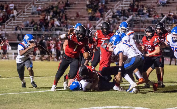 Fort White quarterback Tyler Jefferson scrambles for yardage against Taylor County on Oct. 2. (CHRISTINA FEAGIN/Special to the Reporter)