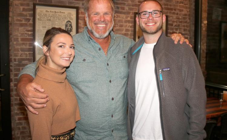 Emilee Southwell (from left), Robby Hollingsworth and Zach Hollingsworth take a break from an election victory dinner Tuesday night after Robby Hollingsworth was elected the Columbia County Commission District 3 representative. (TONY BRITT/Lake City Reporter)