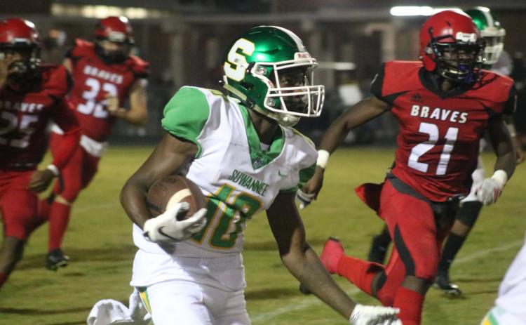 Suwannee’s Jay Smith returns a kickoff against Terry Parker during Friday’s Region 1-5A playoff game. (JAMIE WACHTER/Lake City Reporter)