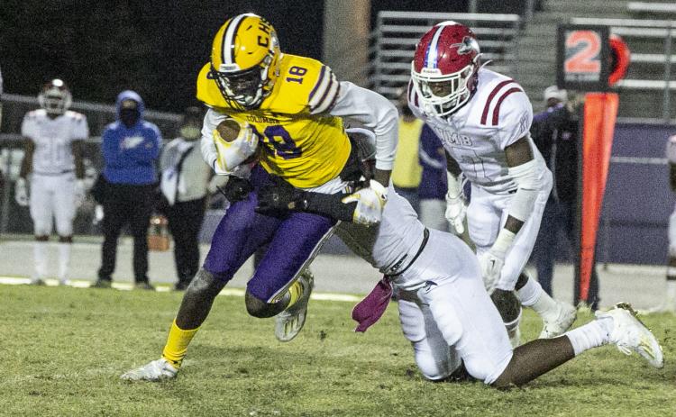 Columbia receiver Marcus Peterson tries to escape a tackle against North Miami Beach last Friday. (JEN CHASTEEN/Special to the Reporter)