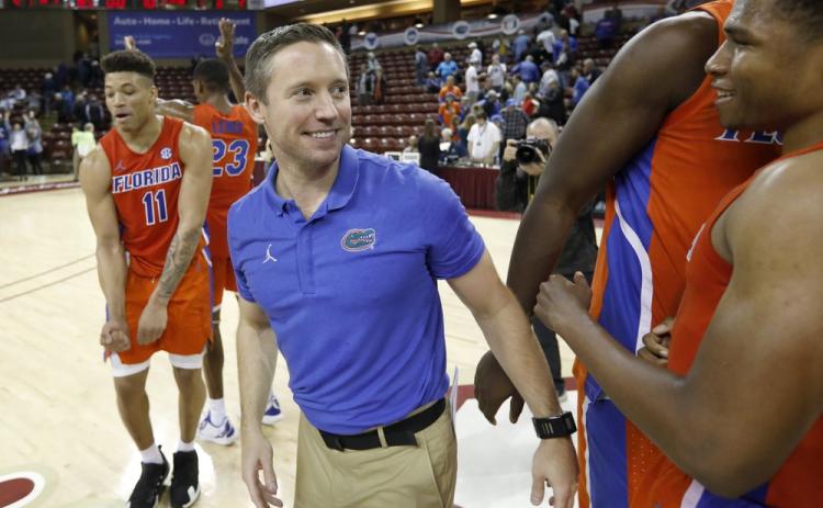 Florida's head coach Mike White celebrates after defeating Xavier 70-65 in the finals of the Charleston Classic on Nov. 24, 2019, in Charleston, S.C. The Gators didn’t have much fun last year. White is eager for his Gators to run and press like never before. Florida is scheduled to open their season on Nov. 25 in Connecticut. (AP FILE PHOTO)