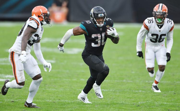 Jacksonville Jaguars running back James Robinson (30) breaks away for a 27-yard gain against the Cleveland Browns at TIAA Bank Field on Sunday in Jacksonville. (BOB SELF/TNS)