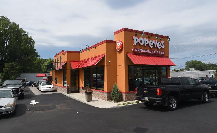 A line of cars forms for the drive-through at a Popeyes in Millcreek, Pa., on the restaurant’s opening day in July 2018. There are plans for a Popeyes to open in Live Oak on U.S. Hwy. 129 N. (JACK HANRAHAN/Erie Times News/TNS)