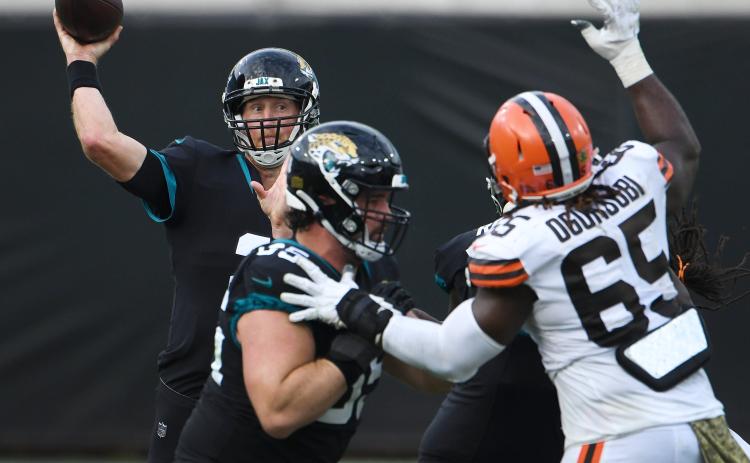 Jacksonville Jaguars quarterback Mike Glennon (2) tries to get off a pass under pressure against the Cleveland Browns at TIAA Bank Field on Sunday in Jacksonville. (BOB SELF/TNS)