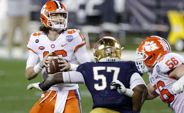 Clemson quarterback Trevor Lawrence, looking to pass in the fourth quarter against Notre Dame during the ACC championship game at Bank of America Stadium on Saturday in Charlotte, North Carolina. Lawrence is the presumed top pick in the 2021 NFL draft, which currently belongs to Jacksonville. (JARED C. TILTON/Getty Images/TNS)