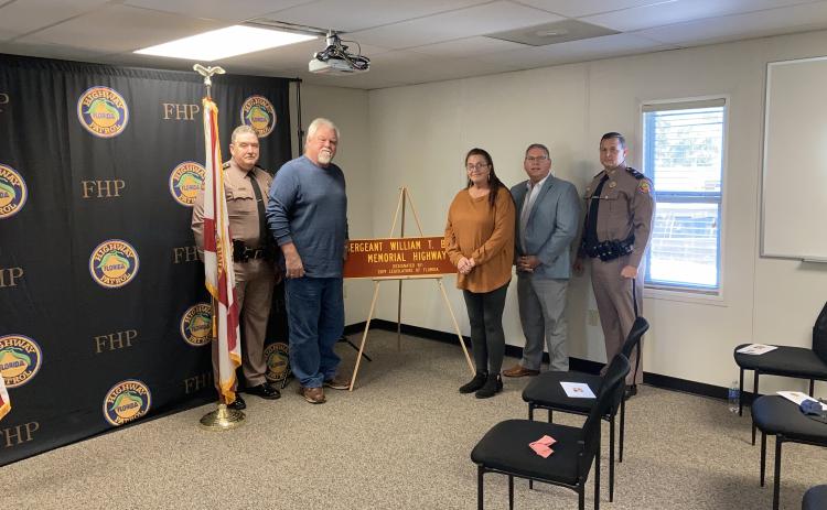 A stretch of Interstate 75 was designated the Sergeant William T. Bishop Memorial Highway on Tuesday. Present for the dedication for the late Florida Highway Patrol trooper were Colonel Gene Spaulding, FHP director (from left); Charles Barnes, Bishop’s brother-in-law; Vanessa Barnes, Bishop’s sister; Chuck Brannan, District 10 state representative; and FHP Lt. Colonel Troy Thompson. (COURTESY)