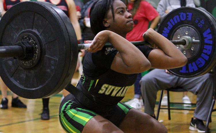 Suwannee’s Tyra Kalandyk lifts during the clean and jerk portion of a meet last season at Suwannee High School. SHS hosts its annual Power of Christmas event today. (PAUL BUCHANAN FILE/Special to the Reporter)