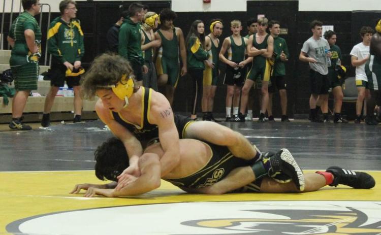 Columbia’s Brett Millard wrestles against Buchholz in a preseason match last month. (COURTESY)