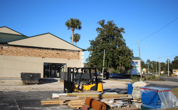 Construction equipment and supplies sit adjacent next to the Duval Place Professional Office plaza Friday, where a portion of  the building is being renovated to house the county’s Tourist Development Council and Economic Development offices. (TONY BRITT/Lake City Reporter)